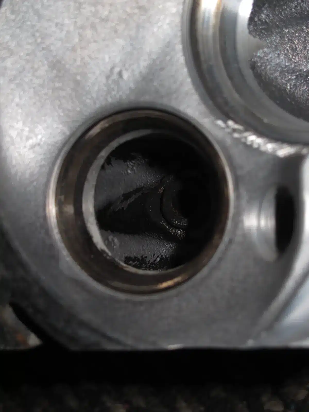 Entrapped air prevented cleaning inside of automotive cylinder head